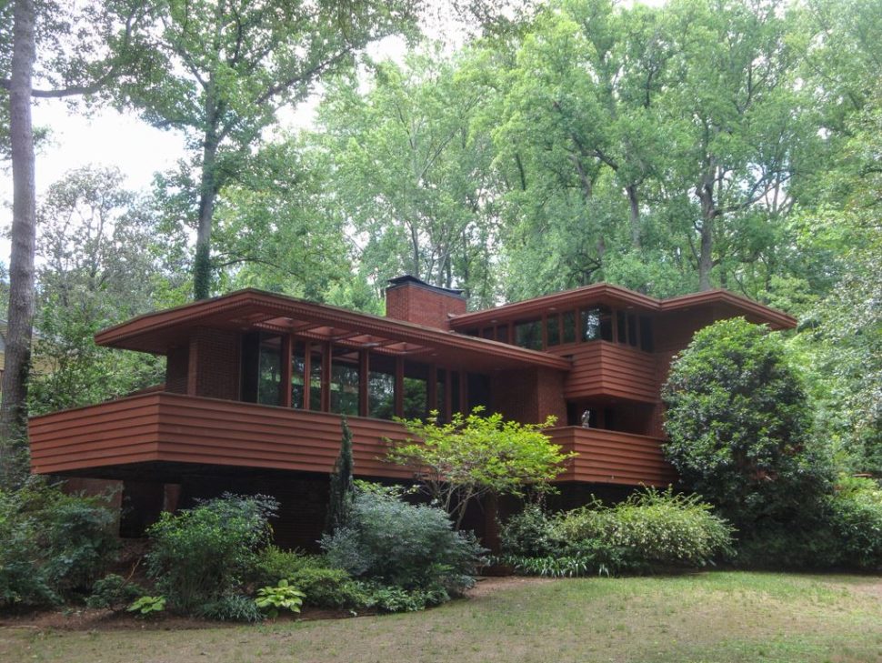 The Copeland House in Atlanta is a home with a wood exterior, plenty of windows, and mid-century modern details inspired by Frank Lloyd Wright.